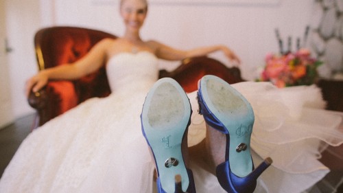 Bride with I Do on bottom of shoes