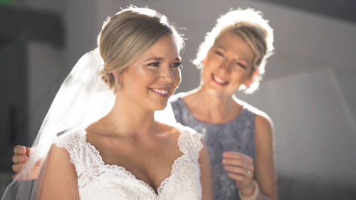 Mom and Bride putting dress on at Lomas Santa Fe Country Club wedding video