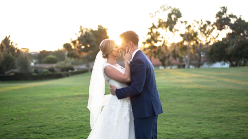 Bride and groom kissing at Lomas Santa Fe Country Club wedding video