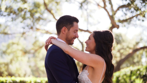 bride and groom under trees in sunlight mt. woodson castle