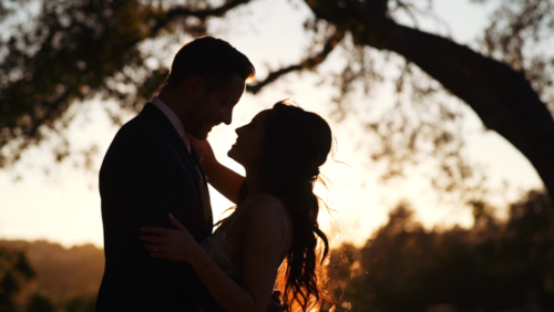 bride and groom silhouetted at sunset mt. woodson castle