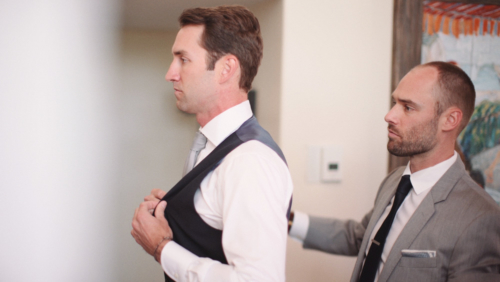 Bestman helping Groom get ready before wedding at Westlake Village Inn