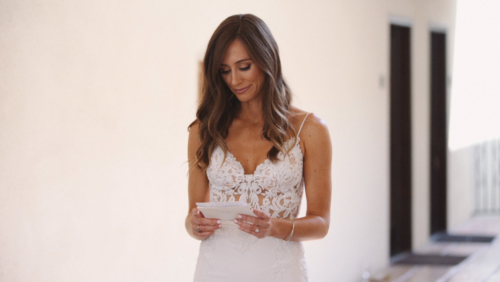 Bride reads card from Groom before ceremony