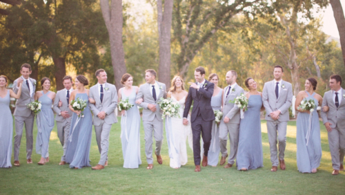 Wedding party walk together in a line at Brookview Ranch Malibu