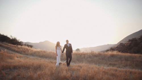 Bride and groom in field at sunset at Brookview Ranch wedding