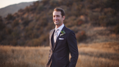 Groom standing in field Brookview Ranch Malibu