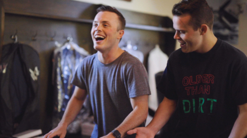 Groom having fun with groomsmen before wedding