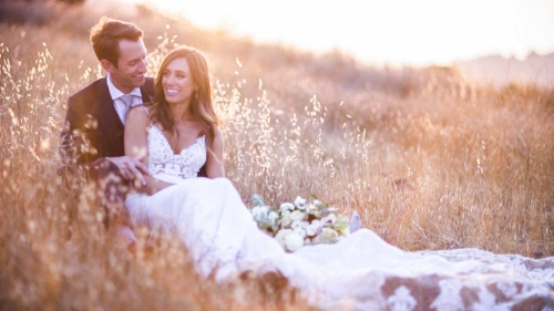 Bride and groom in a field in San Diego at their wedding