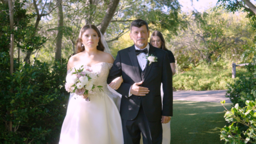 Ethereal Gardens Wedding Bride walks down the aisle with dad