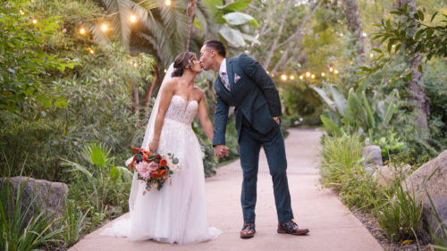 Bride and groom taking wedding photos at Botanica