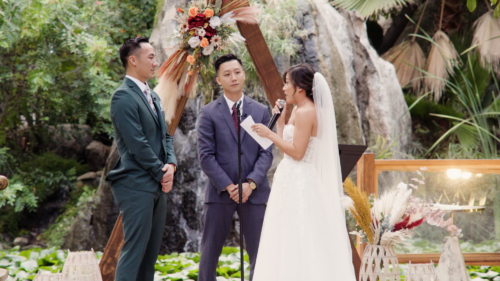 Bride and groom during wedding ceremony at Botanica