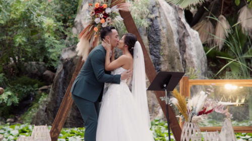 the kiss at wedding at Botanica