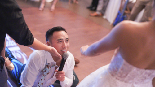 Groom sings to bride at wedding reception at Botanica Trademark venues