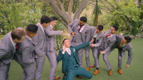 Crazy groomsmen taking photos at Botanica in Oceanside california