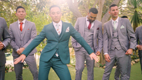 Groom shows his dance moves during photos