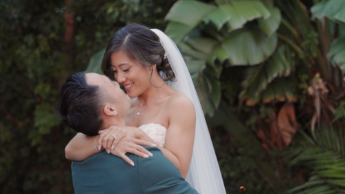 Groom picks up Bride