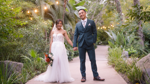 Bride and groom taking wedding photos at Botanica